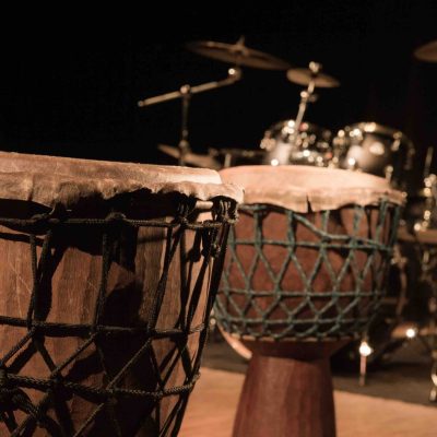 Traditional wooden african djembe drumon stage
